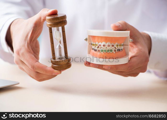 Male doctor stomatologist working in the clinic