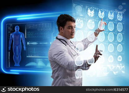 Male doctor studing x-ray image of MRI scan