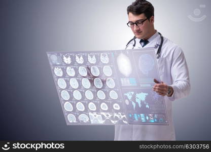 Male doctor studying results of brain mri scan