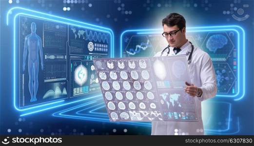 Male doctor studying results of brain mri scan