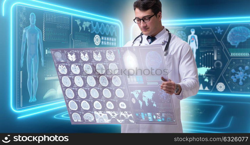 Male doctor studying results of brain mri scan