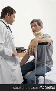 Male doctor talking to a patient in a hospital