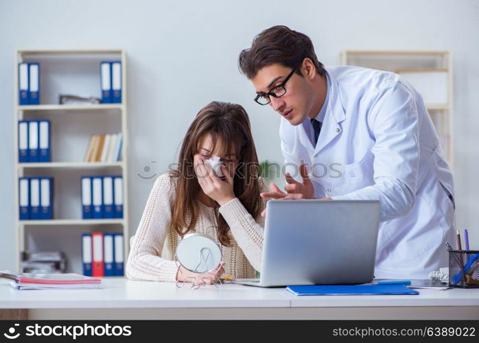 Male doctor talking to patient with nose operation surgery