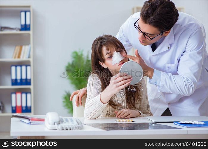 Male doctor talking to patient with nose operation surgery