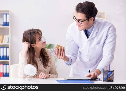 Male doctor talking to patient with nose operation surgery