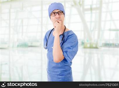 male doctor thinking at the hospital