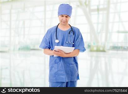 male doctor thinking with his notes at the hospital