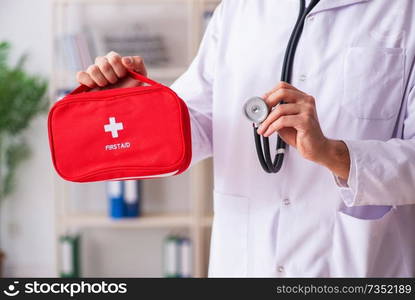 Male doctor with first aid bag 