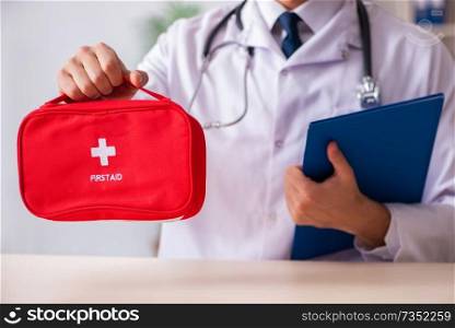 Male doctor with first aid bag 