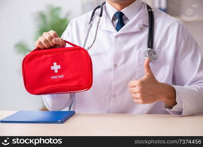 Male doctor with first aid bag 