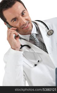 Male doctor with mobile telephone