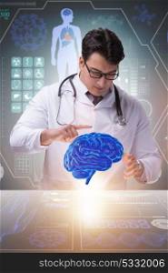 Male doctor with the brain in medical concept