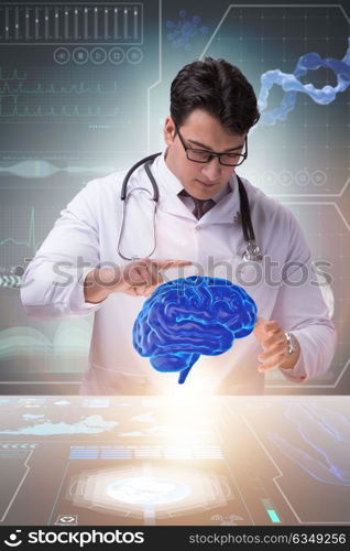 Male doctor with the brain in medical concept