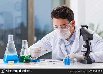 Male doctor working in the lab on virus vaccine