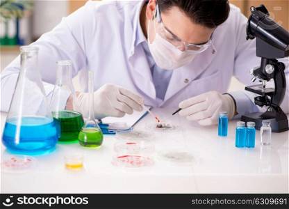 Male doctor working in the lab on virus vaccine
