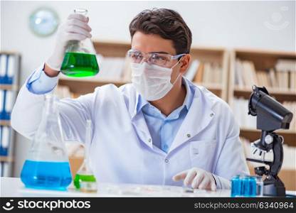 Male doctor working in the lab on virus vaccine