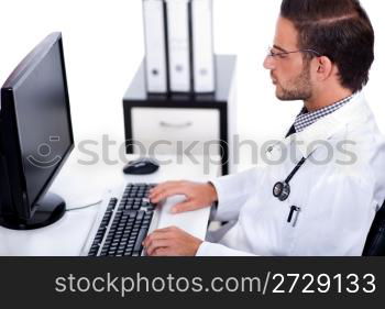 male doctor working with desktop at his desk over white background