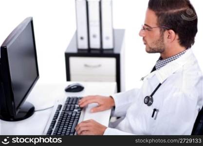 male doctor working with desktop at his desk over white background