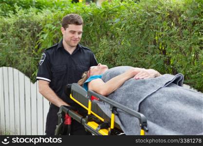 Male emergency worker pushing a stretcher