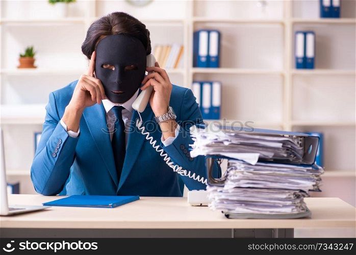 Male employee in the office in industrial espionage concept   