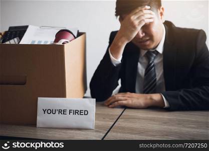 Male employee is stressed or angry while he is fired from being an employee of the company.