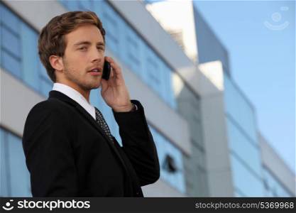 Male executive using a cellphone