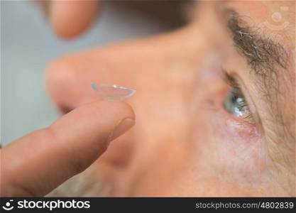 male eye with contact lens close up