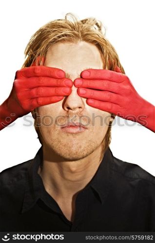 male face with eyes closed women&rsquo;s hands
