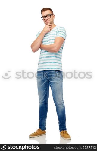 male, fashion and people concept - smiling young man in eyeglasses over white thinking
