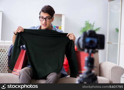 Male fashion blogger recording video for vlog