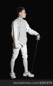 Male fencer holding a fencing foil