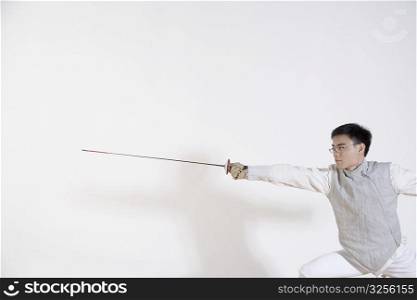 Male fencer practicing fencing