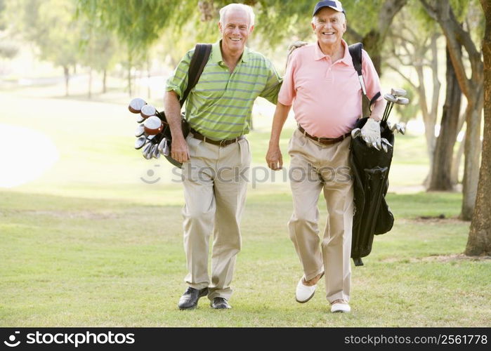 Male Friends Enjoying A Game Of Golf