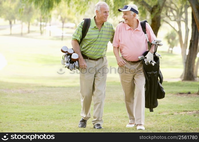 Male Friends Enjoying A Game Of Golf