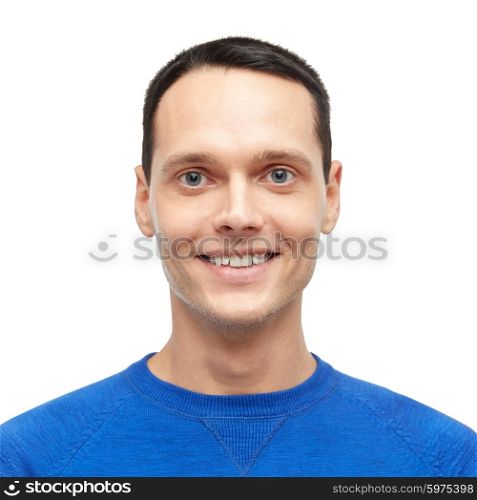 male, gender, fashion and people concept - smiling young man in blue pullover portrait
