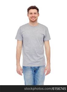 male, gender, fashion and people concept - smiling young man in gray t-shirt and jeans