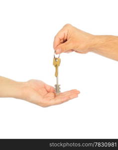 Male hand holding a car key and handing it over to another person isolated