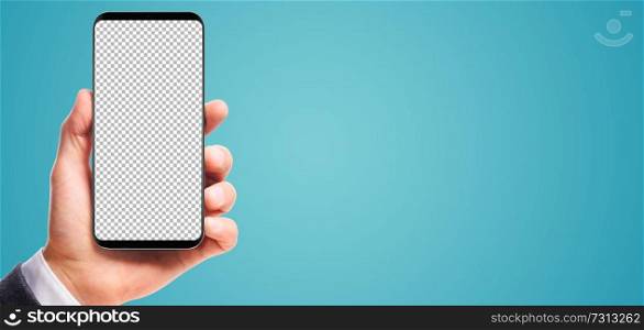 male hand holding bezel-less smartphone with transparent screen, isolated on blue background . Screen is cut out with path. hand holding bezel-less smartphone