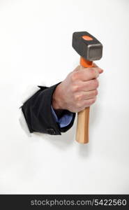 male hand holding hammer