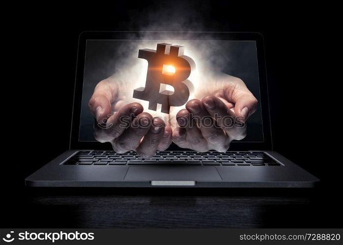 Male hand out of laptop screen presenting bitcoin concept. 3D rendering. Crypto currency concept. Mixed media