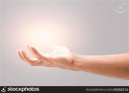 Male hand to hold something on a gray background.