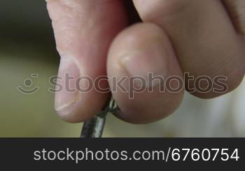 Male hand turns key in the lock