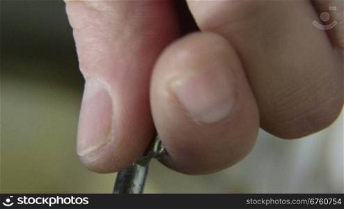 Male hand turns key in the lock