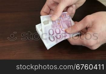 Male Hands Counting Euro Cash
