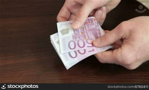 Male Hands Counting Euro Cash