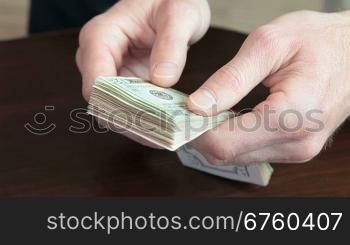 Male Hands Fast Counting US Dollars