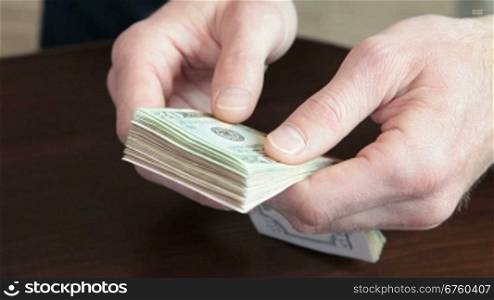 Male Hands Fast Counting US Dollars