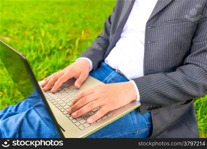 male hands of a businessman working with a laptop