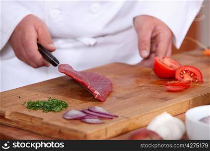 Male hands preparing steak