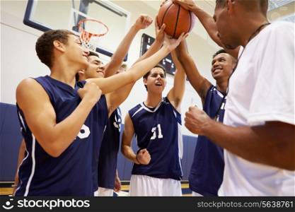 Male High School Basketball Team Having Team Talk With Coach